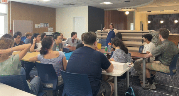 URaCE Executive Director Lisa Piazza talks to students at the meet-and-greet event.